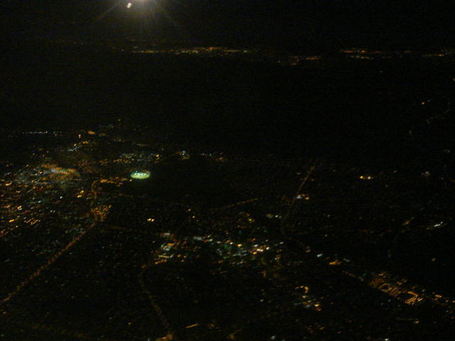 View out the window seat at night (a city in Jersey?)